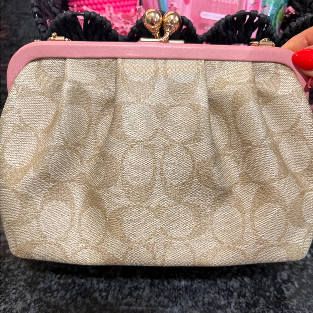 Signature Canvas Tan/Pink Colored Coach Bag.